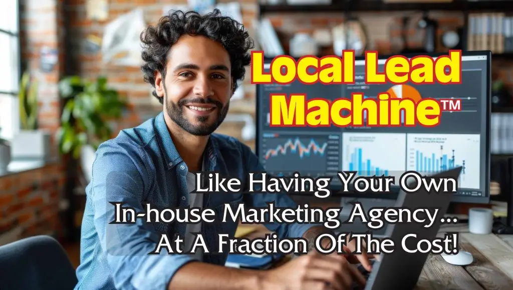 Young business man smiling and working on a laptop computer with monitors behind him displaying information