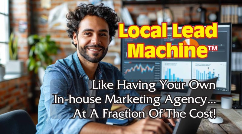 Young business man smiling and working on a laptop computer with monitors behind him displaying information