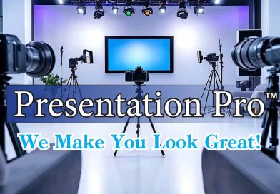 A Lit Screen on a tripod in the center of a semi dim lit room with cameras pointed at it